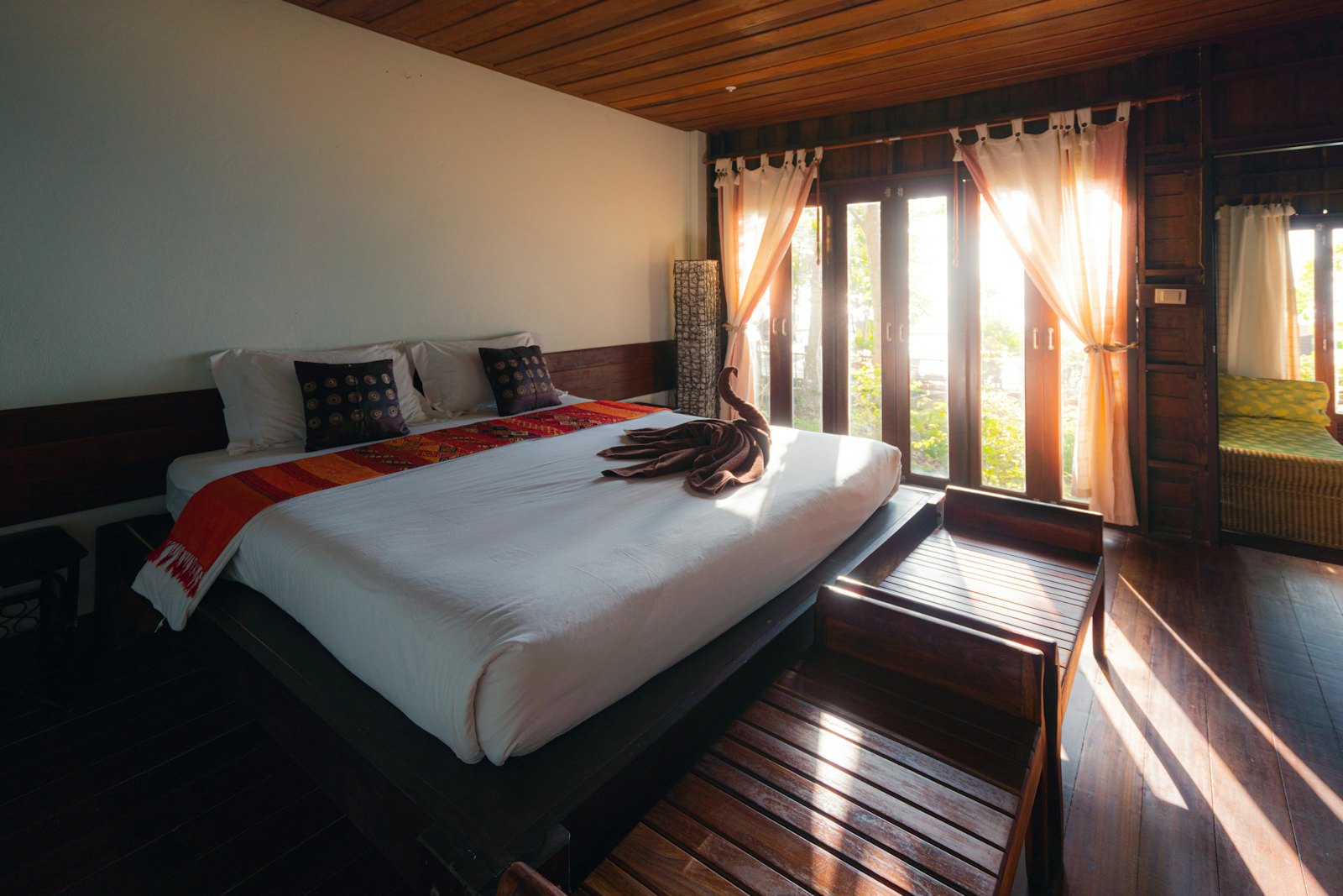 Comfortable room with a large bed and warm wooden interiors