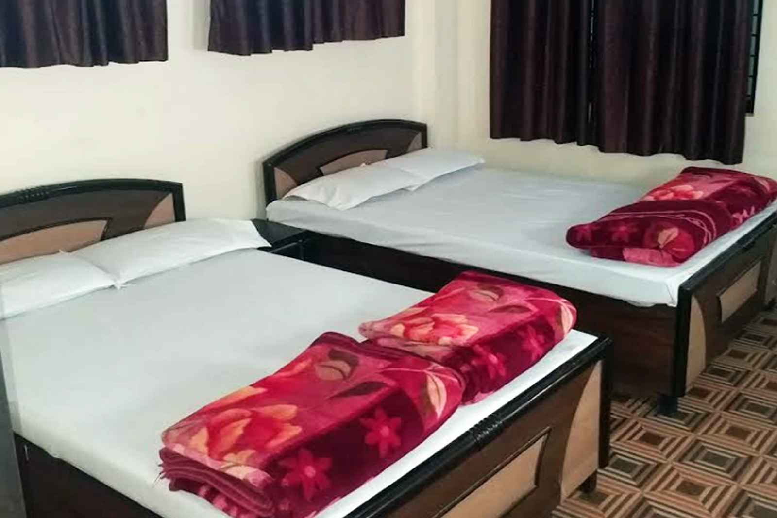 Bright, spacious hotel room with a large bed and work area